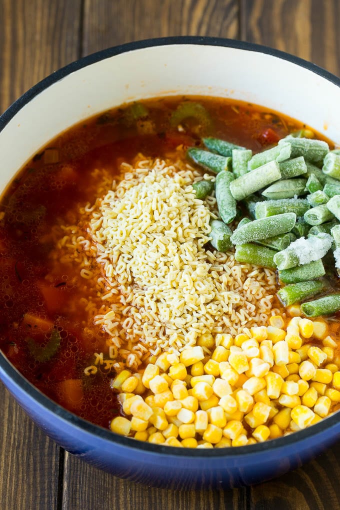 Alphabet Soup Recipe | Hamburger Soup | Beef and Vegetable Soup #soup #hamburger #noodles #dinner #jonep #carrots A pot with noodles, broth, frozen corn and frozen green beans.