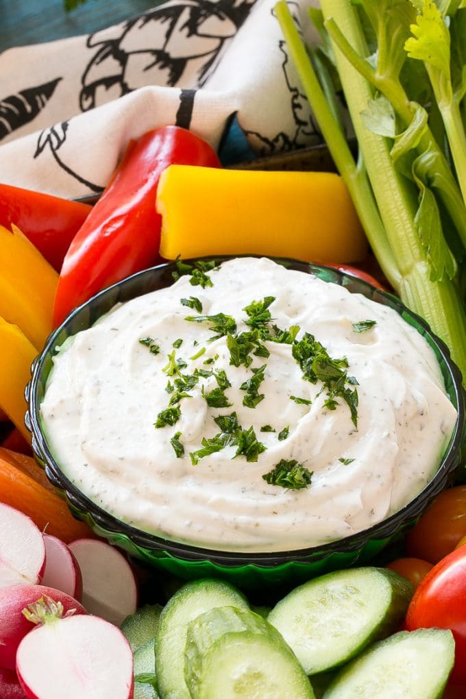 Homemade Ranch Dip Recipe | Homemade Ranch Powder | Homemade Ranch Dressing | Best Ranch Dip #ranch #dip #appetizer #snack #jonep A bowl of dip topped with chopped parsley and surrounded by vegetables.