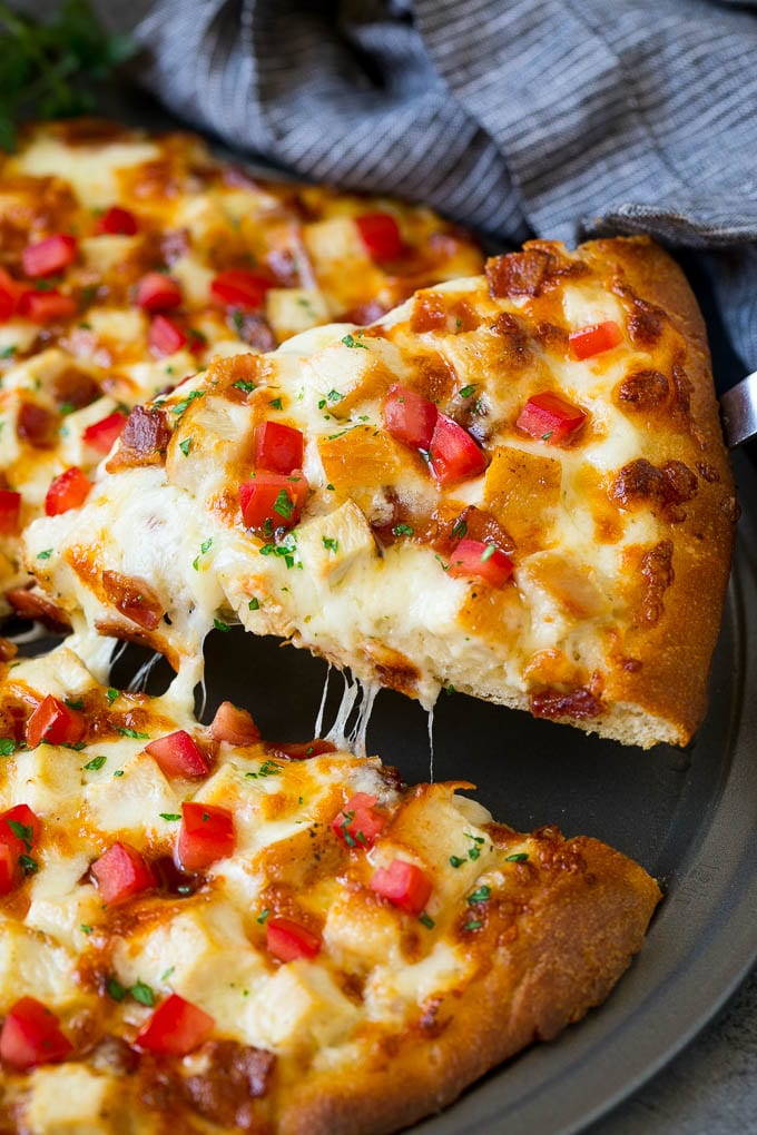 Chicken Alfredo Pizza Recipe #pizza #chicken #bacon #dinner #jonep A slice of chicken Alfredo pizza with bacon and fresh tomatoes.