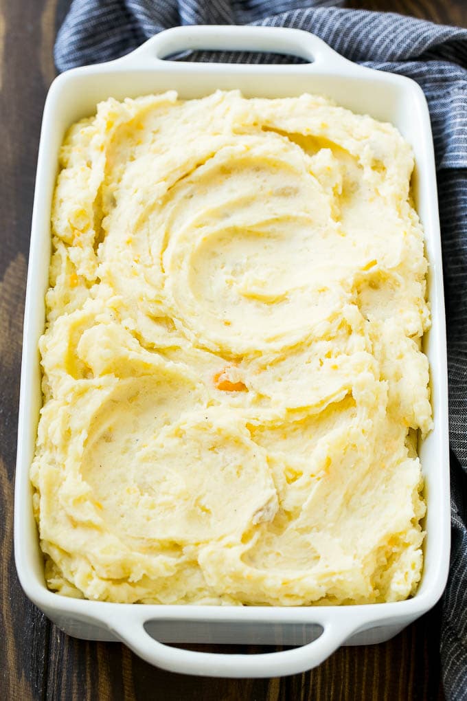 Loaded Mashed Potato Casserole Recipe | Loaded Potatoes | Bacon Mashed Potatoes | Thanksgiving Mashed Potatoes #potatoes #bacon #cheese #casserole #Thanksgiving #dinner #jonep Mashed potatoes in a baking dish.