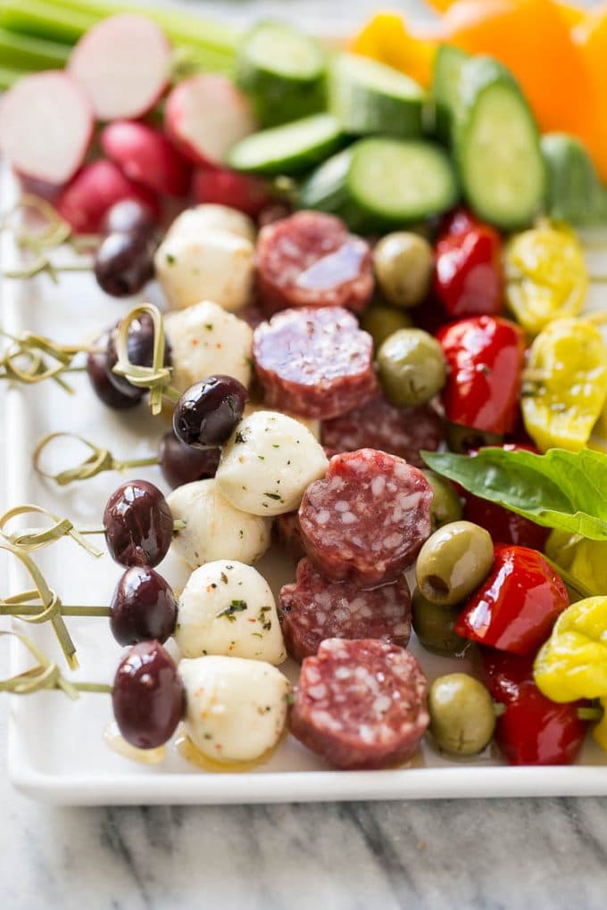 Antipasto Skewers Recipe | Easy Antipasto | Best Antipasto #antipasto #skewers #appetizer #jonep Antipasto skewers on a white serving platter.