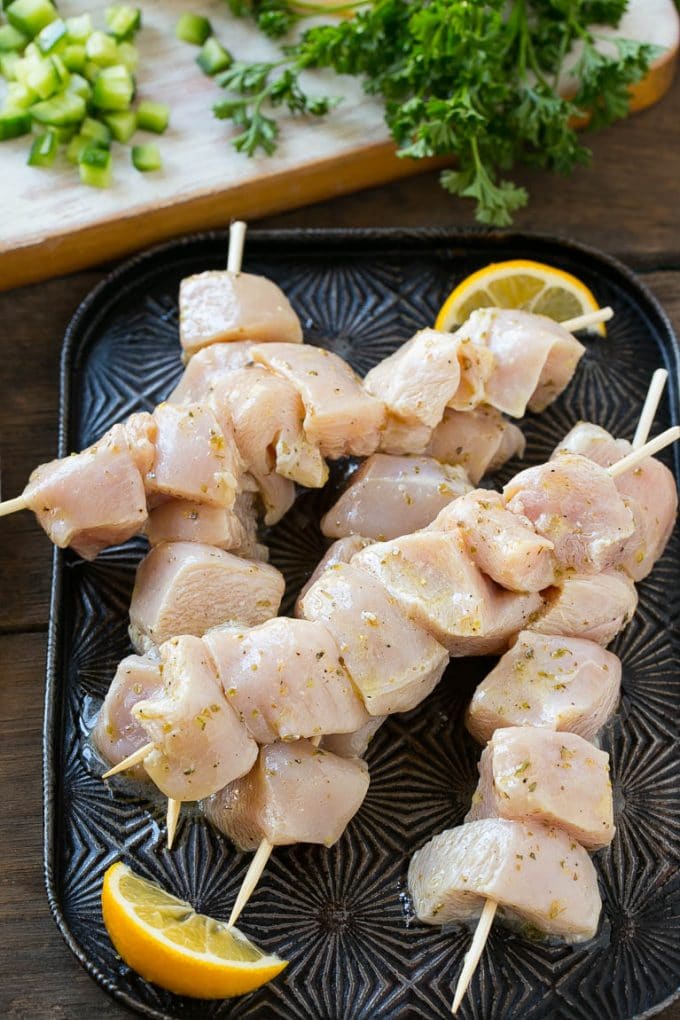 Greek Chicken Souvlaki Recipe | Easy Greek Chicken | Chicken Souvlaki | Greek Chicken Skewers | Easy Greek Chicken Skewers #chicken #kabobs #glutenfree #keto #lowcarb #grilling #jonep Chunks of marinated chicken breast threaded onto skewers to be grilled.