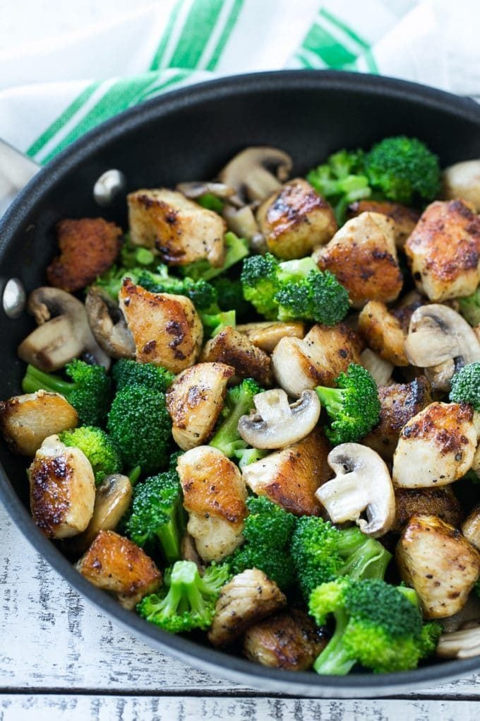 Chicken and Broccoli Stir Fry Recipe | Chicken Stir Fry | Healthy Chicken Recipe | Chicken and Broccoli | Chinese Food #chicken #broccoli #stirfry #healthy #cleaneating #dinner #jonep Sauteed chicken pieces, broccoli florets and mushrooms in a pan.