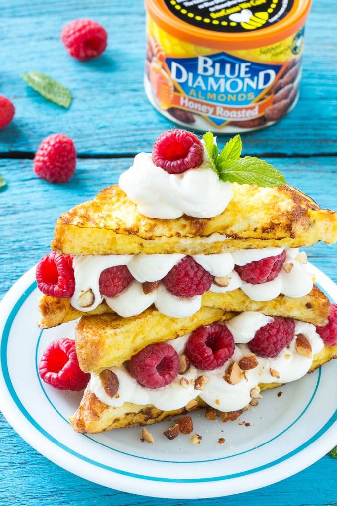 Stuffed French Toast | Cream Cheese Stuffed French Toast | French Toast Recipe #frenchtoast #raspberry #creamcheese #breakfast #brunch #jonep French toast filled with cream cheese and raspberries, then topped with maple syrup.