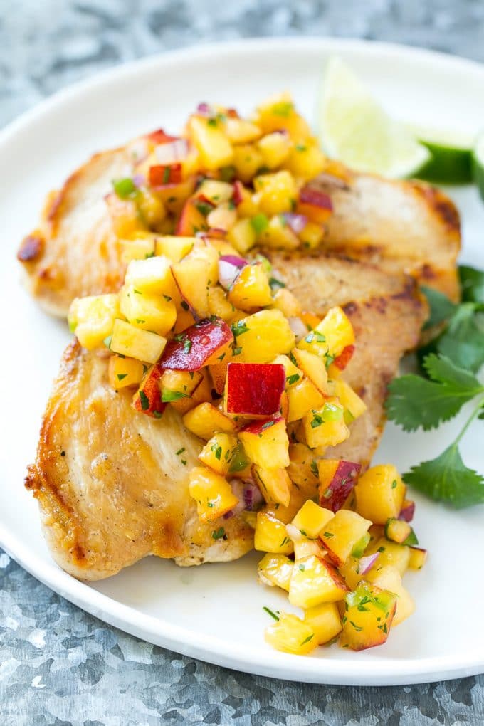 Peach Salsa | Fruit Salsa #peaches #salsa #dip #appetizer #jonep Peach salsa served over grilled chicken breast.