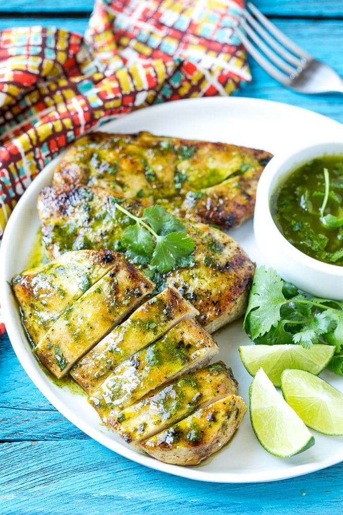 Cilantro Lime Chicken | Grilled Chicken #chicken #grilling #cilantro #lime #dinner #jonep Sliced cilantro lime chicken on a serving plate.