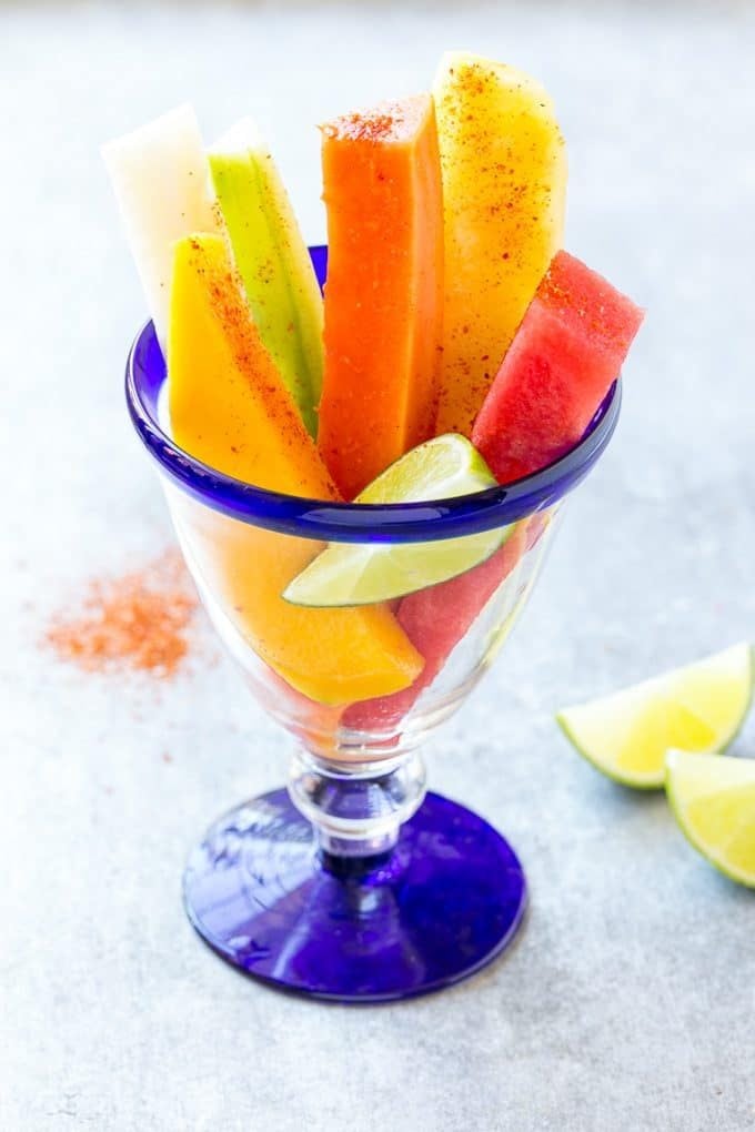 Mexican Fruit Cups | Fruit Cups | Mexican Fruit | Tropical Fruit #fruit #fruitcup #watermelon #pineapple #snack #healthy #jonep Mexican fruit cups topped with chili lime seasoning.