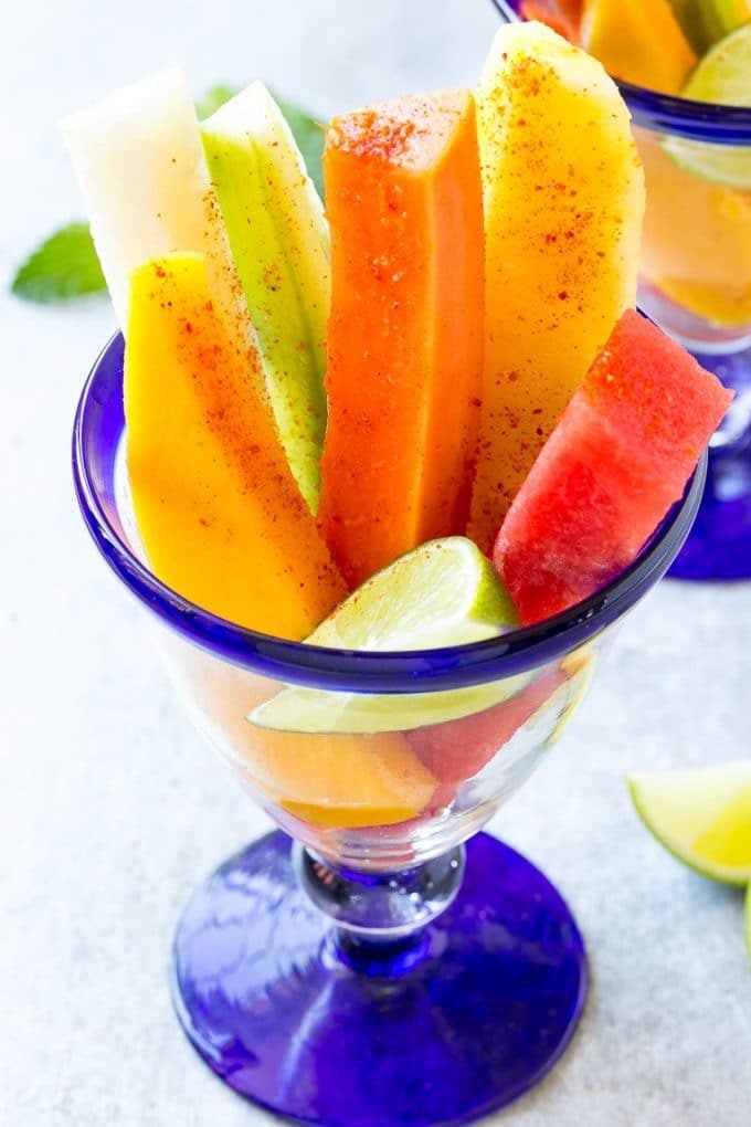 Mexican Fruit Cups | Fruit Cups | Mexican Fruit | Tropical Fruit #fruit #fruitcup #watermelon #pineapple #snack #healthy #jonep Fruit cups filled with watermelon, cucumber, papaya and mango.