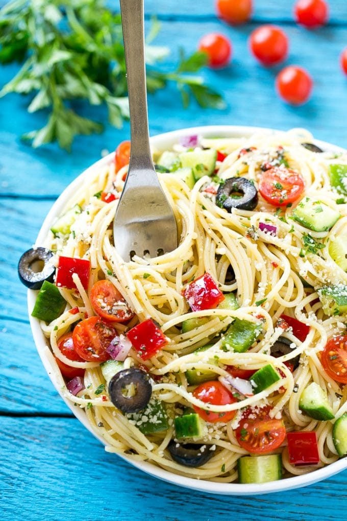 Spaghetti Salad Recipe | Pasta Salad | Potluck Recipe | Easy Pasta Salad #spaghetti #pasta #salad #jonep A bowl of spaghetti salad with a serving fork in it.
