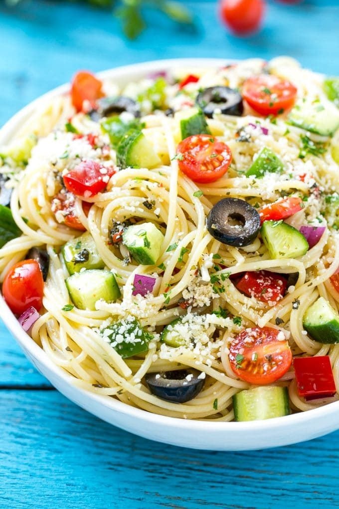 Spaghetti Salad Recipe | Pasta Salad | Potluck Recipe | Easy Pasta Salad #spaghetti #pasta #salad #jonep A bowl of pasta salad with cucumbers, olives and parmesan cheese.