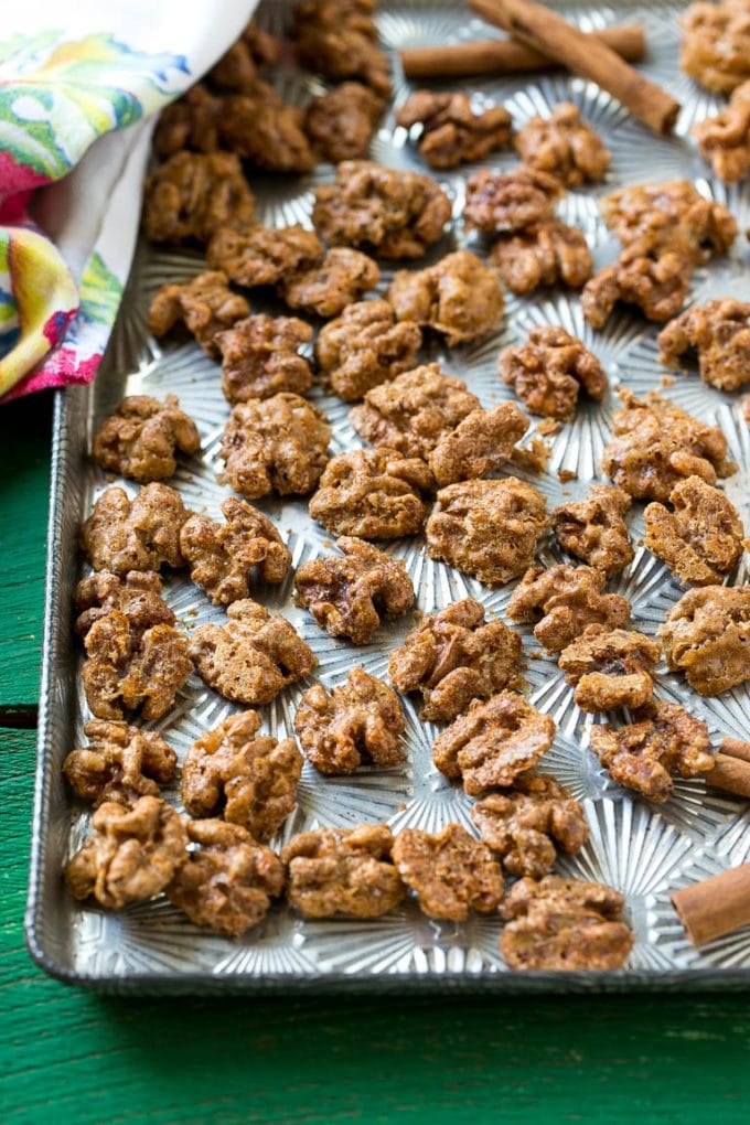 Candied Walnuts Recipe | Candied Nuts | Glazed Walnuts | Cinnamon Sugar Walnuts #walnuts #dessert #snack #jonep A sheet pan with a layer of glazed walnut halves.