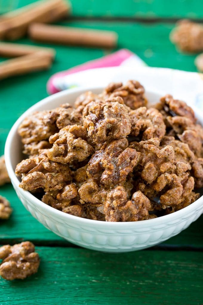 Candied Walnuts Recipe | Candied Nuts | Glazed Walnuts | Cinnamon Sugar Walnuts #walnuts #dessert #snack #jonep A white bowl filled with candied walnuts.