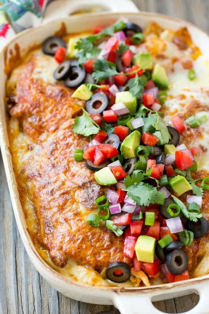 Chicken Enchilada Casserole Recipe | Chicken Enchiladas | Easy Casserole Recipe | Enchilada Casserole #chicken #casserole #enchiladas #cheese #beans #dinner #jonep Chicken enchilada casserole topped with avocado, tomatoes and olives.