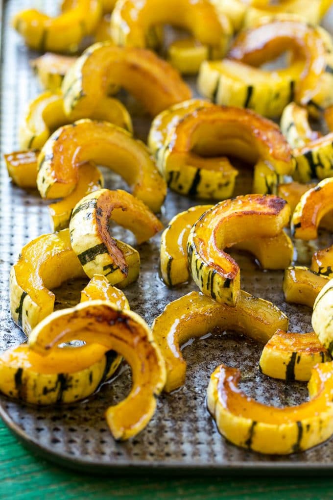Brown Sugar Delicata Squash Recipe | Roasted Squash | Delicata Squash | Winter Squash Recipe #squash #wintersquash #brownsugar #sidedish #delicatasquash #dinner #jonep A delicata squash recipe with brown sugar roasted squash on a sheet pan.