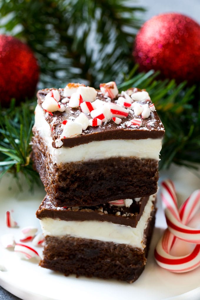 Peppermint Brownies Recipe | Holiday Brownies | Candy Cane Brownies | Mint Brownies #brownies #mint #peppermint #chocolate #dessert #christmas #jonep These layered treats on a plate are simple to make yet look so impressive.