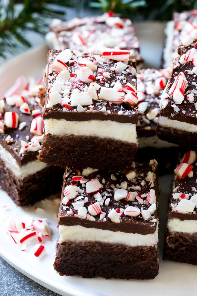 Peppermint Brownies Recipe | Holiday Brownies | Candy Cane Brownies | Mint Brownies #brownies #mint #peppermint #chocolate #dessert #christmas #jonep These layered peppermint brownies are full of flavor and so festive for the holidays with crushed candy canes on top.