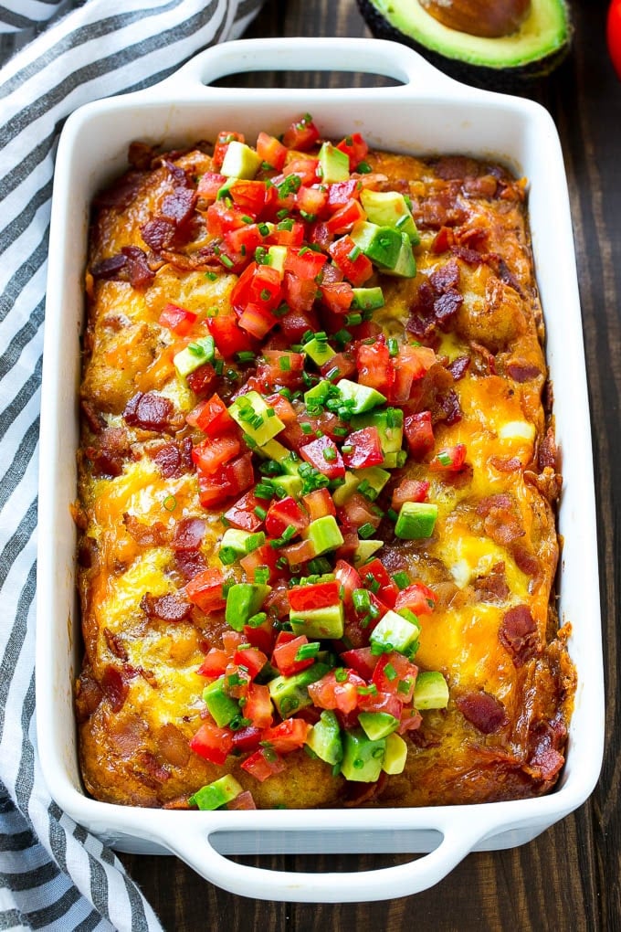 Breakfast Casserole with Bacon Recipe | Bacon and Egg Casserole | Egg Casserole with Bacon | Bacon Breakfast Casserole #eggs #bacon #casserole #breakfast #brunch #jonep A breakfast casserole with bacon that is topped with avocado and tomato.