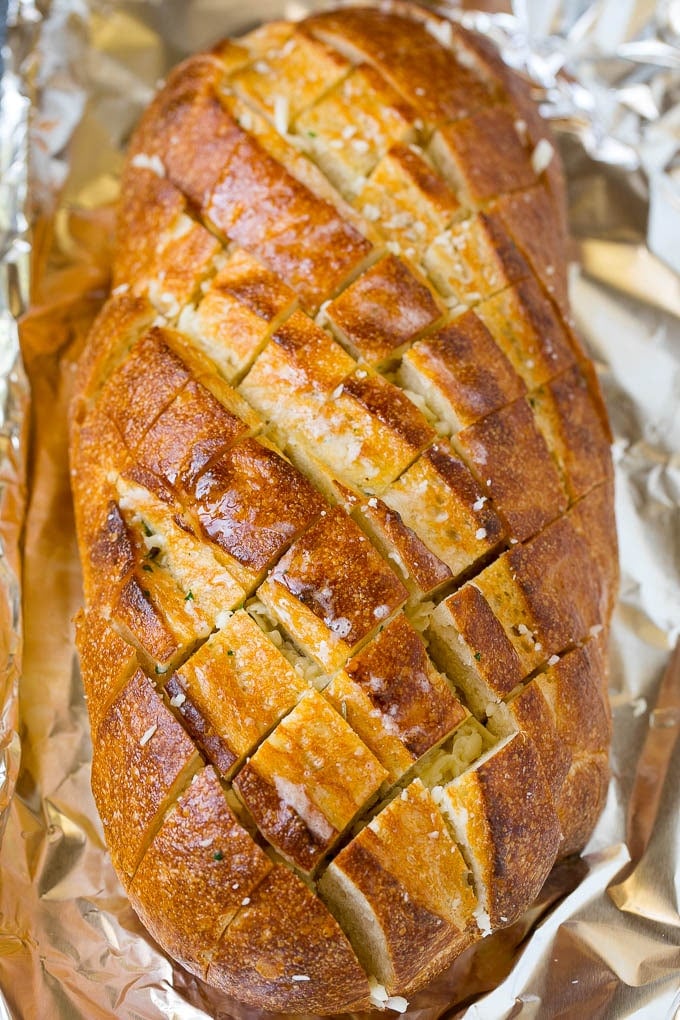 Pull Apart Bread | Garlic Bread | Cheese Bread #bread #garlic #cheese #sidedish #appetizer #jonep Garlic butter and shredded cheese stuffed into a cut loaf of bread.