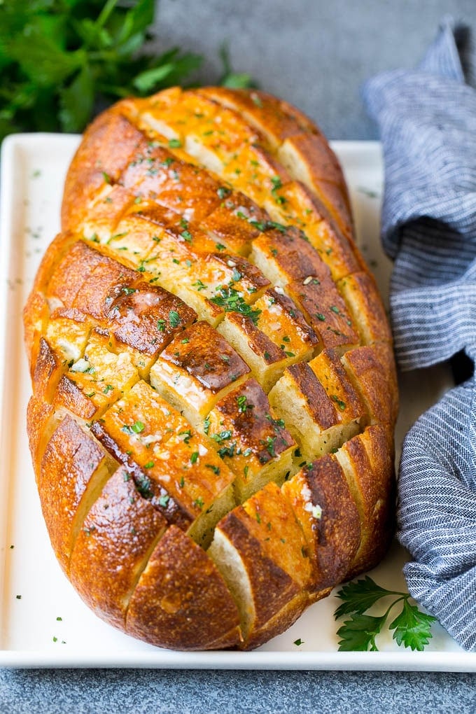 Pull Apart Bread | Garlic Bread | Cheese Bread #bread #garlic #cheese #sidedish #appetizer #jonep Baked garlic pull apart bread garnished with parsley.