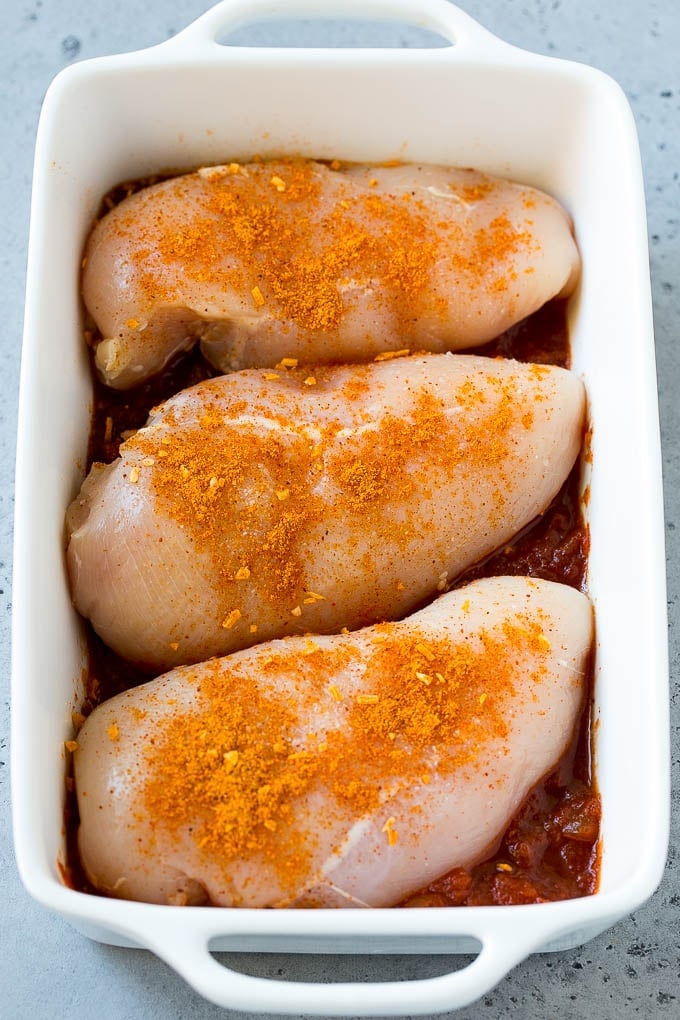 Salsa Chicken Recipe | Baked Chicken | Mexican Chicken #chicken #salsa #mexican #lowcarb #keto #glutenfree #dinner #jonep Poultry in a baking dish topped with taco seasoning.