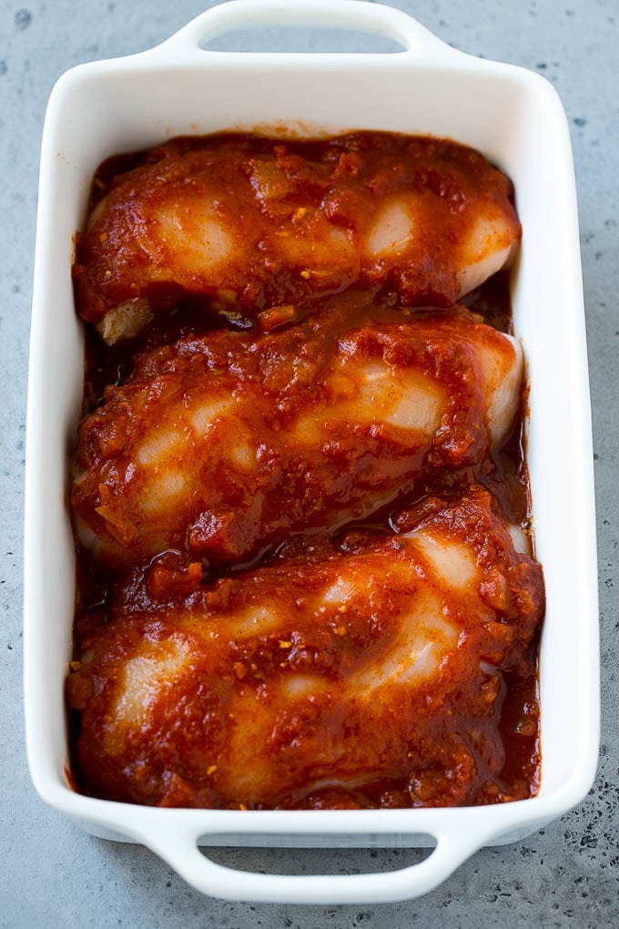 Salsa Chicken Recipe | Baked Chicken | Mexican Chicken #chicken #salsa #mexican #lowcarb #keto #glutenfree #dinner #jonep Chicken breasts in a baking dish coated with salsa.