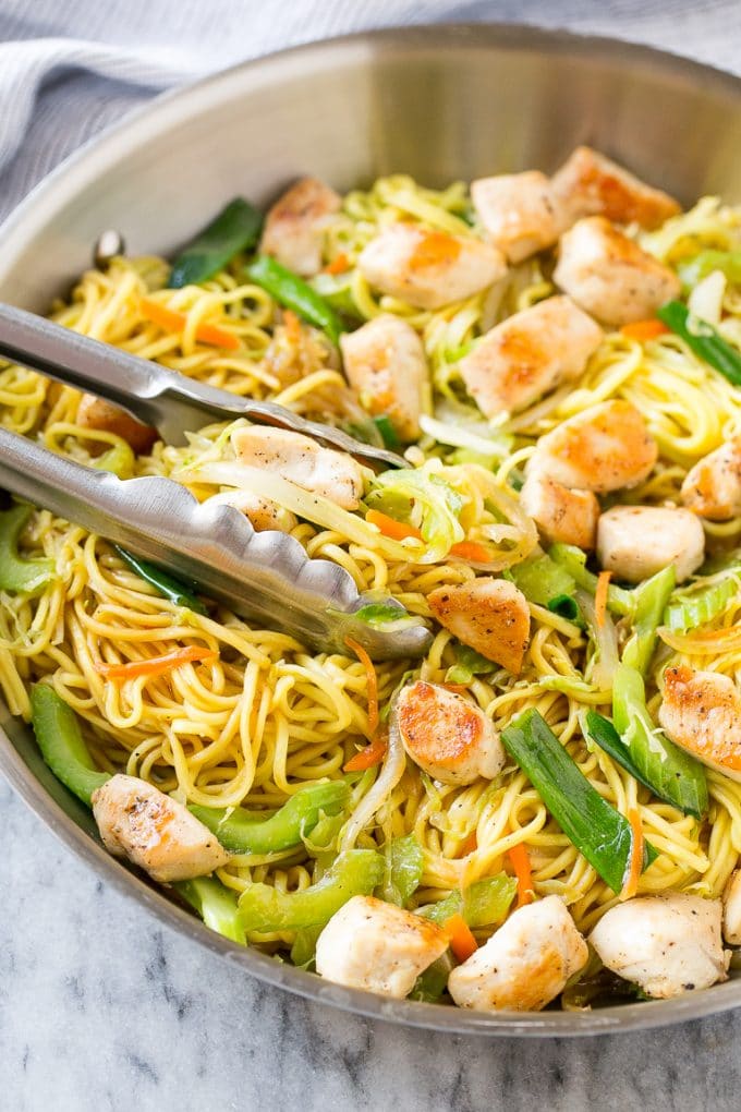 Chicken Chow Mein Recipe | Easy Chicken Recipe | Chow Mein | Chinese Food #chowmein #takeout #asianfood #jonep A pan of chicken chow mein with serving tongs in it.