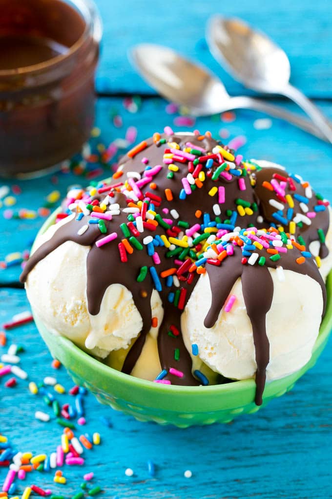 Homemade Magic Shell Recipe | Chocolate Ice Cream Topping | Chocolate Sauce | Hard Chocolate Coating #chocolate #icecream #dessert #jonep Magic shell over vanilla ice cream with rainbow sprinkles.