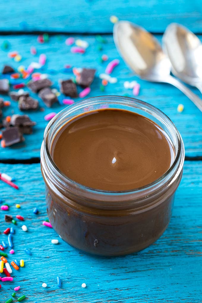 Homemade Magic Shell Recipe | Chocolate Ice Cream Topping | Chocolate Sauce | Hard Chocolate Coating #chocolate #icecream #dessert #jonep A jar of chocolate chocolate shell.