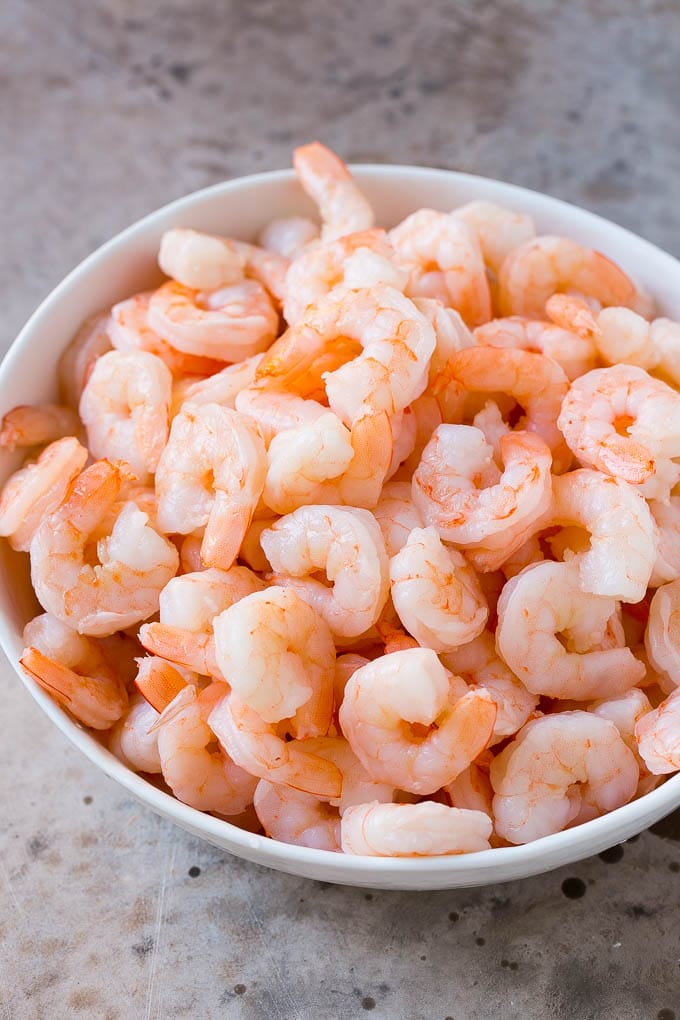 Shrimp Ceviche Recipe | Mexican Shrimp | Marinated Shrimp #shrimp #ceviche #cleaneating #healthy #lowcarb #keto #glutenfree #dinner #appetizer #jonep Cooked prawns in a serving bowl.