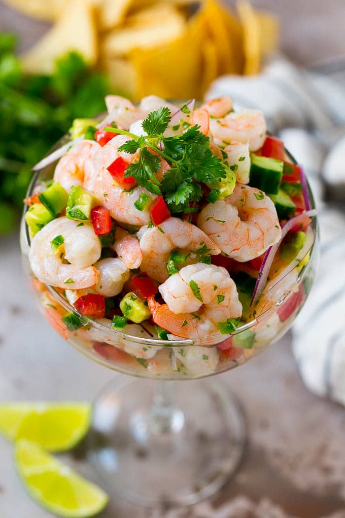 Shrimp Ceviche Recipe | Mexican Shrimp | Marinated Shrimp #shrimp #ceviche #cleaneating #healthy #lowcarb #keto #glutenfree #dinner #appetizer #jonep Shrimp ceviche in a serving cup garnished with cilantro.