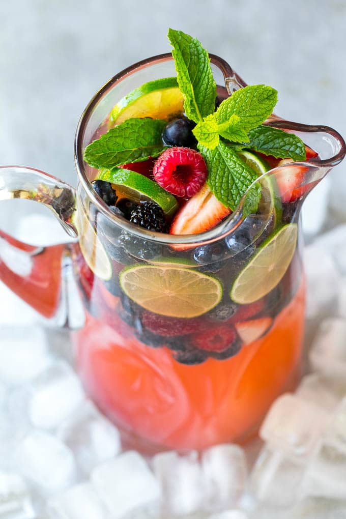 Berry Champagne Punch Recipe | Champagne Cocktail | Lime Cocktail | Berry Punch | Champagne Recipe #champagne #punch #berries #drink #jonep A pitcher of champagne punch filled with fresh berries and mint sprigs.