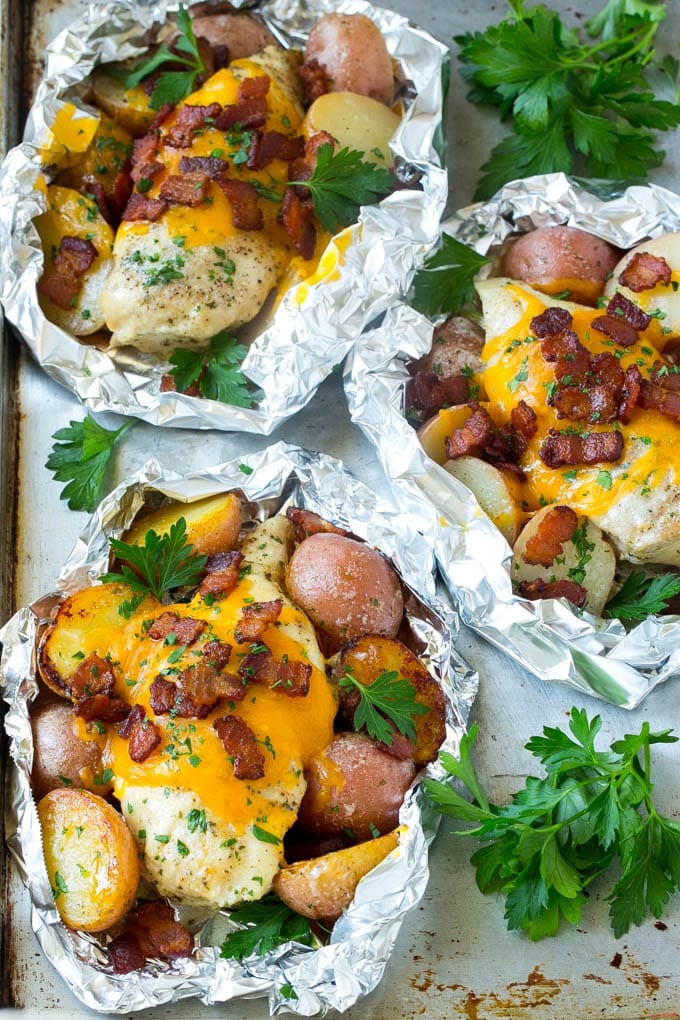 Bacon Ranch Chicken Foil Packets | Chicken in Foil | Foil Packet Recipe | Ranch Chicken #ranchchicken #grilling #chicken #foilpacket #foilpackets #bacon #dinner #jonep Chicken foil packets with potatoes, bacon and parsley.