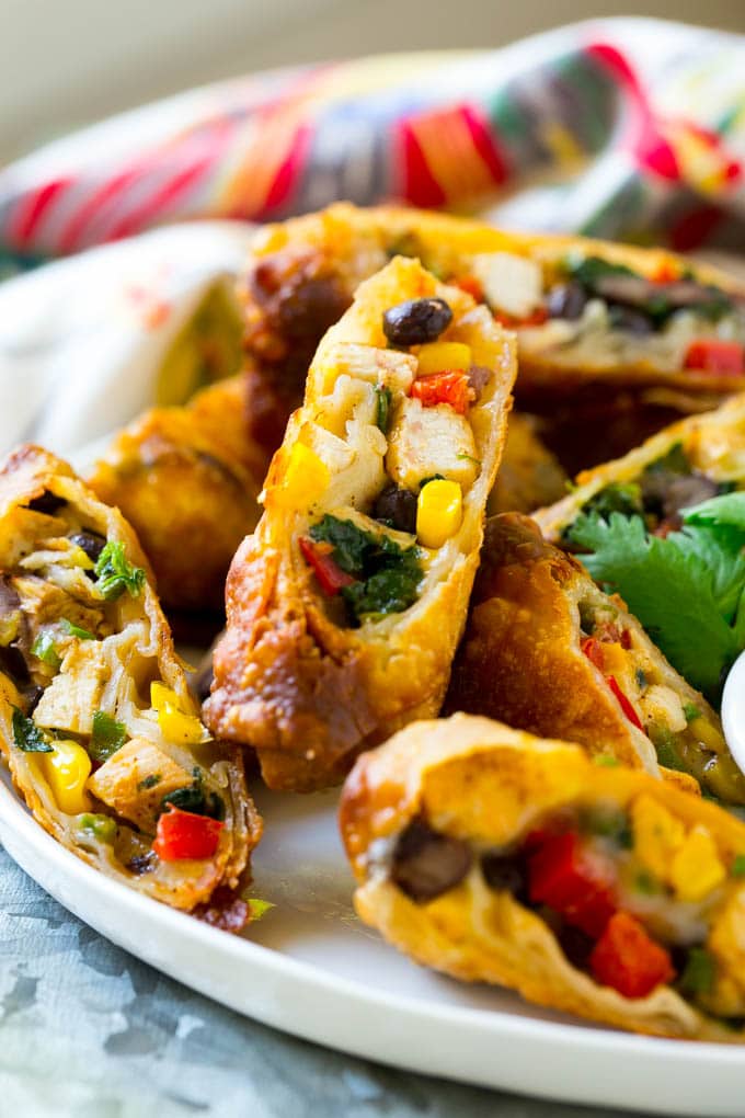 Southwestern Egg Rolls Recipe | Easy Egg Roll Recipe | Mexican Appetizer | Egg Roll Recipe | Southwest Egg Rolls #eggrolls #appetizer #chicken #snack #jonep Chicken egg rolls with colorful vegetables, cut and served with avocado ranch sauce.