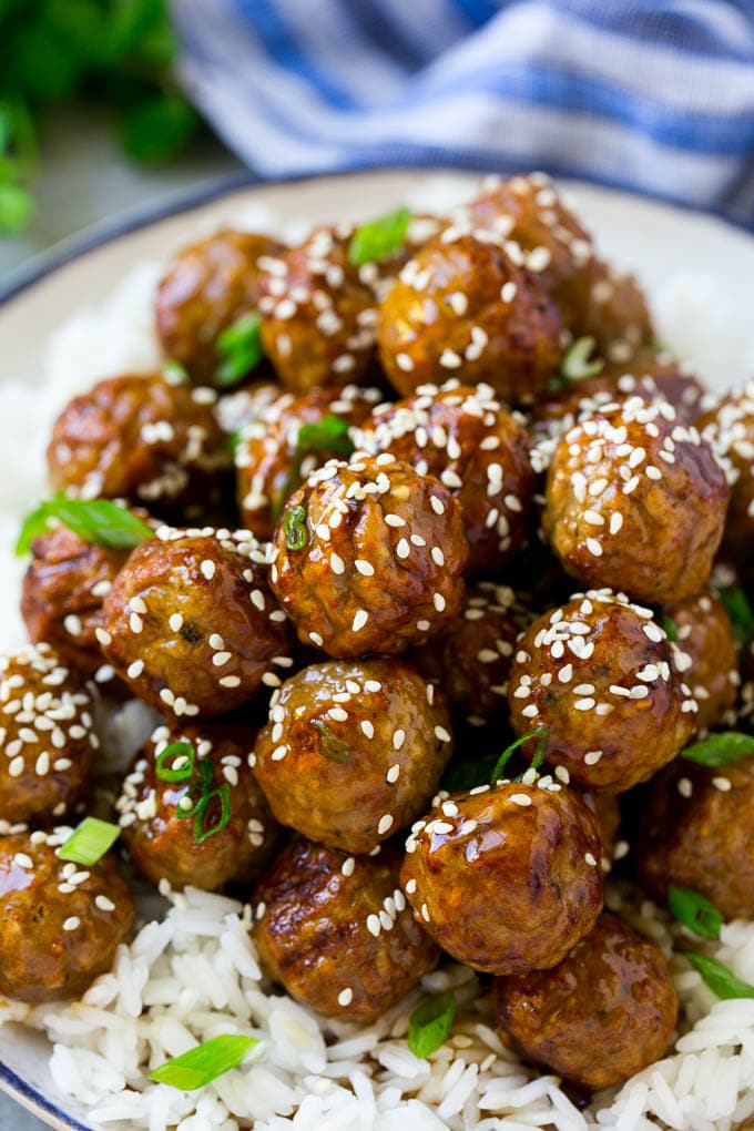 Teriyaki Meatballs Recipe | Asian Meatballs Recipe | Easy Meatball Recipe | Appetizer Meatballs #meatballs #teriyaki #beef #rice #dinner #jonep Meatballs topped with homemade sauce and sesame seeds.