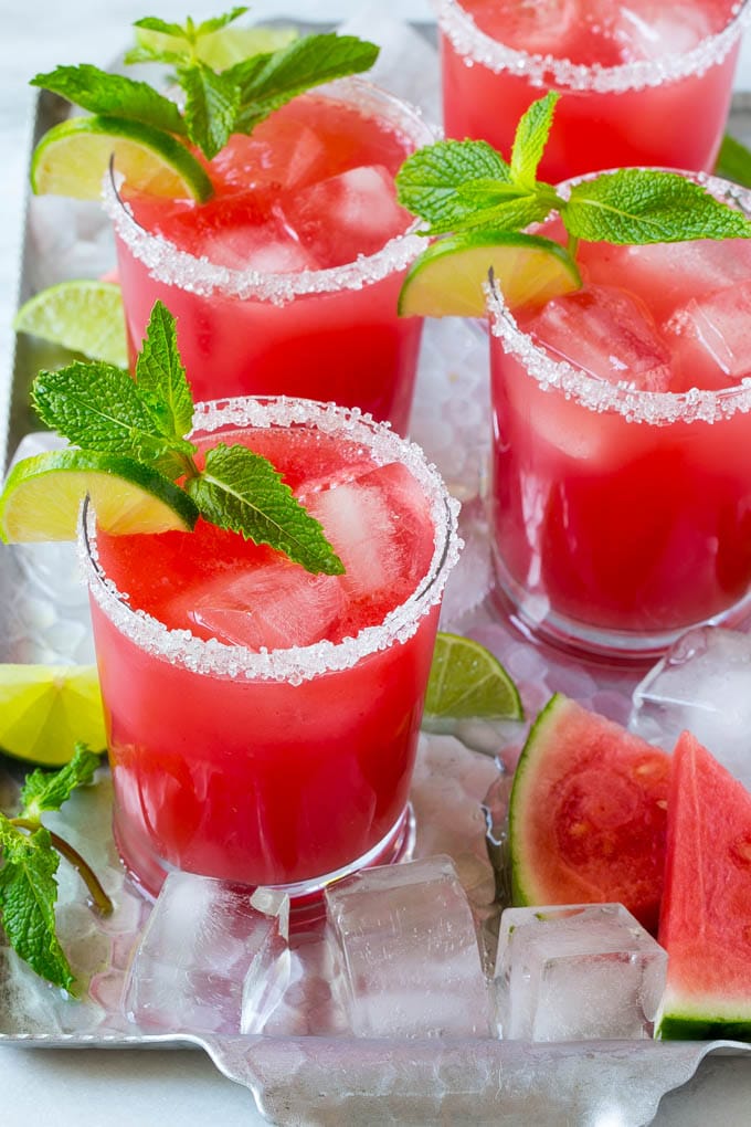 Watermelon Agua Fresca | Watermelon Drink | Agua Fresca Recipe #watermelon #aguafresca #watermelondrink #drink #jonep #summer Watermelon agua fresca in sugar rimmed glasses with lime and mint for garnish.