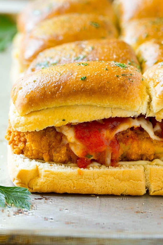 Chicken Parmesan Sliders | Chicken Parmesan Sandwich Recipe | Slider Sandwich Recipe #sliders #chickenparm #chickenparmesan #chickenparmesansliders #dinner #appetizer #jonep Crispy chicken with tomato sauce and cheese on slider buns.