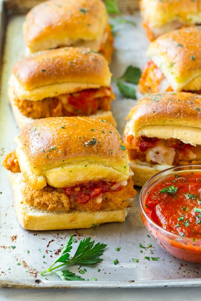 Chicken Parmesan Sliders | Chicken Parmesan Sandwich Recipe | Slider Sandwich Recipe #sliders #chickenparm #chickenparmesan #chickenparmesansliders #dinner #appetizer #jonep Chicken parmesan sliders made with crispy chicken, marinara sauce and cheese on buns.