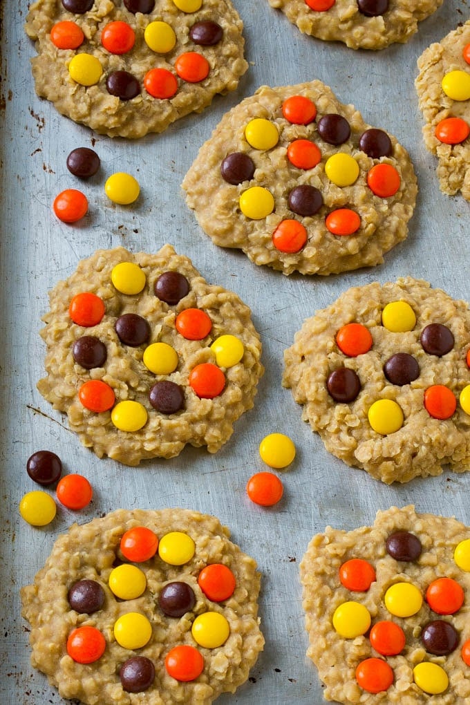 No Bake Peanut Butter Cookies Recipe | No Bake Cookies | Peanut Butter Cookies #peanutbutter #cookies #nobake #nobakecookies #peanutbuttercookies #dessert #jonep A sheet pan full of cookies with candies on top.