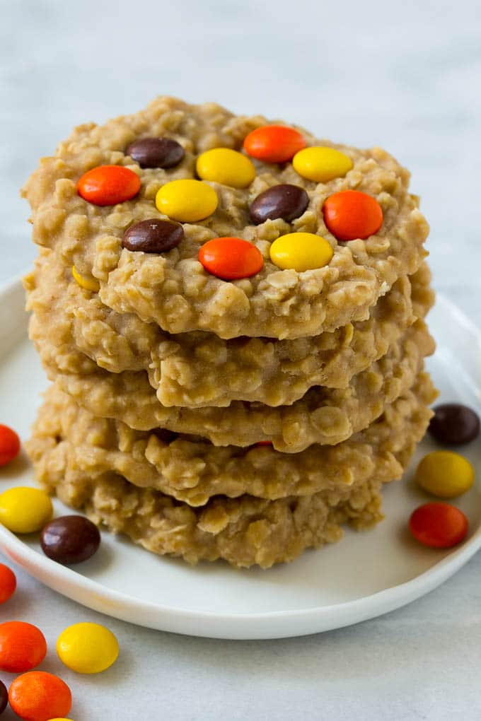 No Bake Peanut Butter Cookies Recipe | No Bake Cookies | Peanut Butter Cookies #peanutbutter #cookies #nobake #nobakecookies #peanutbuttercookies #dessert #jonep A plate with a stack of no bake peanut butter cookies.