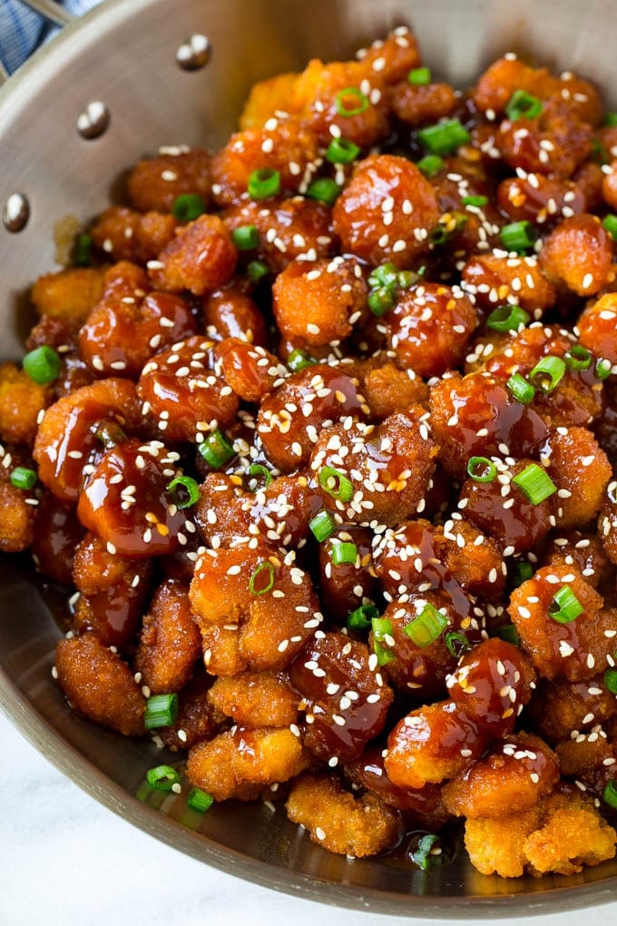 Sesame Shrimp Recipe | Crispy Shrimp | Popcorn Shrimp | Asian Shrimp | Easy Shrimp Recipe #shrimp #fried #friedshrimp #sesameshrimp #crispy #popcornshrimp #chinese #asian #dinner #jonep A pan of popcorn shrimp in an Asian sesame sauce.