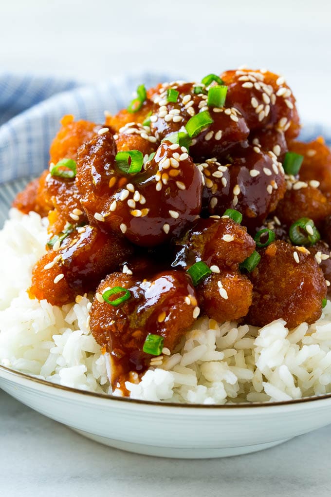 Sesame Shrimp Recipe | Crispy Shrimp | Popcorn Shrimp | Asian Shrimp | Easy Shrimp Recipe #shrimp #fried #friedshrimp #sesameshrimp #crispy #popcornshrimp #chinese #asian #dinner #jonep A bowl of Asian style crispy sesame shrimp over rice.