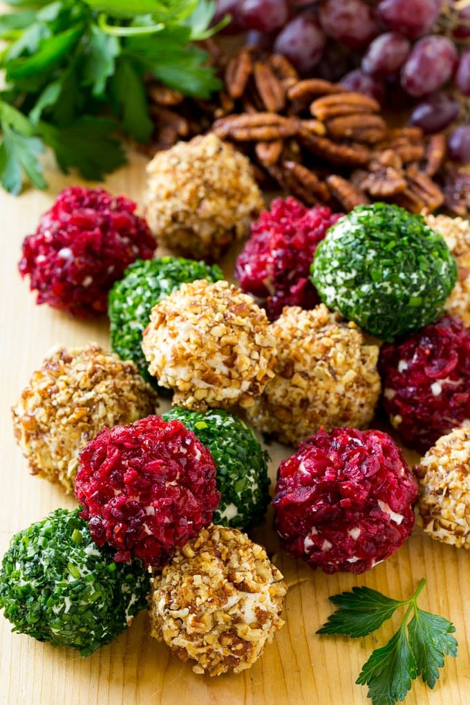 Cheese Ball Bites Recipe | Holiday Cheese Ball Recipe | Pecan Cheese Ball | Cranberry Cheese Ball | Mini Cheese Balls #cheeseball #cheese #appetizer #jonep Cheese ball bites rolled in assorted toppings and served with fruit and nuts.
