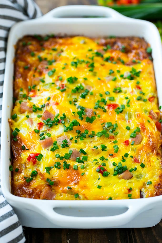Hash Brown Egg Casserole Recipe | Breakfast Casserole with Ham | Hash Brown Casserole | Ham and Egg Casserole | Egg Casserole with Ham #casserole #breakfast #eggs #egg #hashbrown #jonep Hash brown casserole with ham, vegetables and cheese in a baking dish,