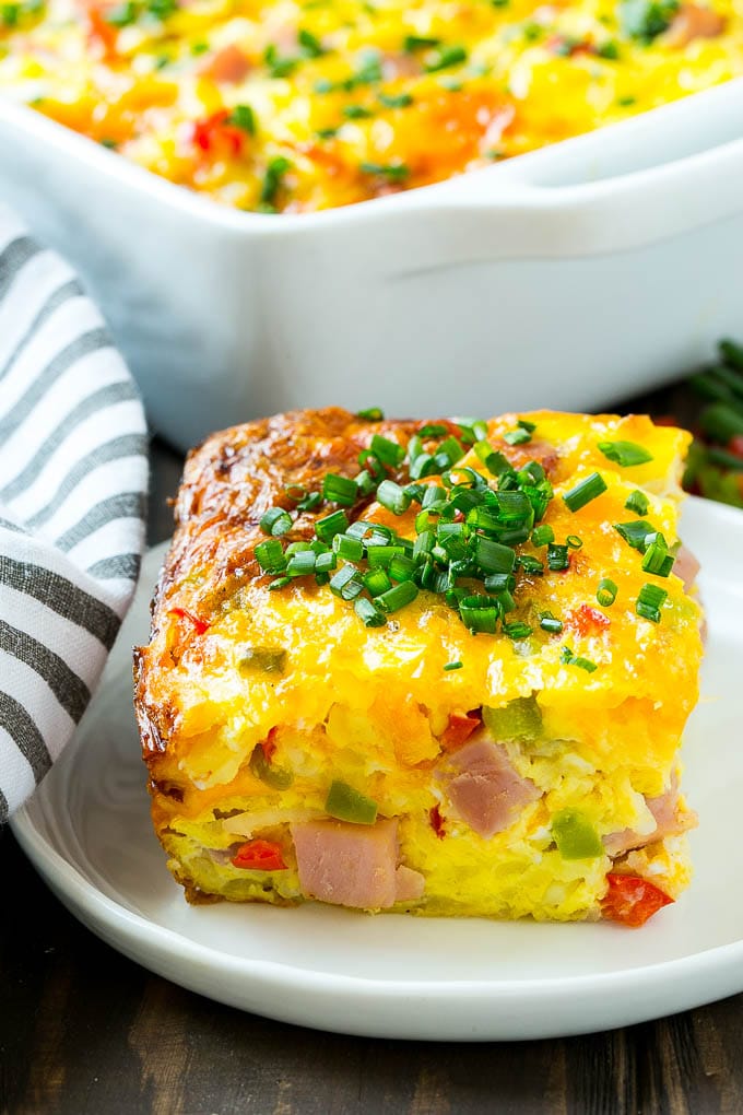 Hash Brown Egg Casserole Recipe | Breakfast Casserole with Ham | Hash Brown Casserole | Ham and Egg Casserole | Egg Casserole with Ham #casserole #breakfast #eggs #egg #hashbrown #jonep A cut slice of hash brown casserole.