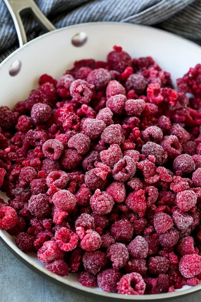 Raspberry Sauce Recipe | Homemade Raspberry Sauce | Raspberry Recipe #raspberries #dessert #jonep A pan of frozen berries.
