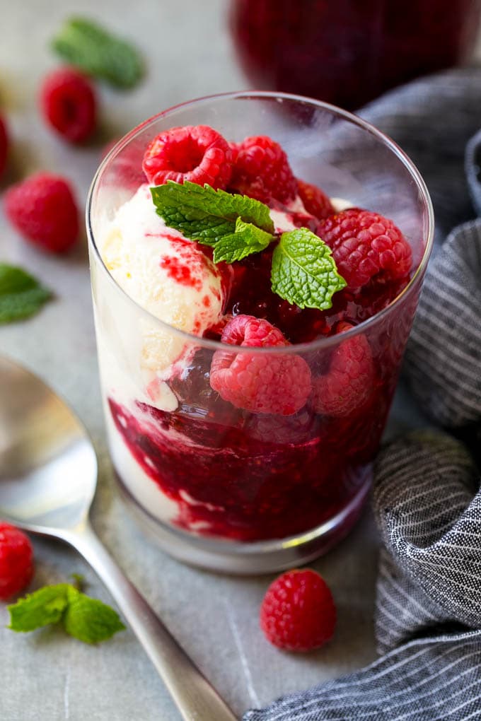 Raspberry Sauce Recipe | Homemade Raspberry Sauce | Raspberry Recipe #raspberries #dessert #jonep A cup of vanilla ice cream with raspberry sauce and fresh raspberries.