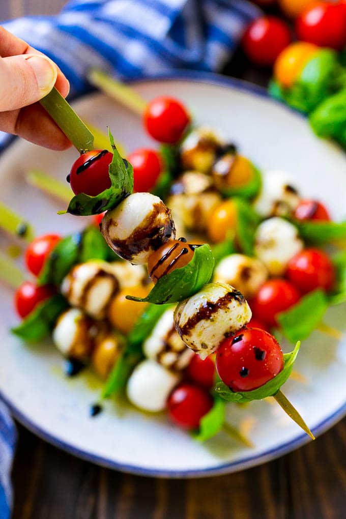 Caprese Skewers | Caprese Kabobs | Caprese Appetizer #tomato #mozzarella #basil #caprese #appetizer #jonep A kabob of mozzarella, tomatoes and basil drizzled with balsamic glaze.