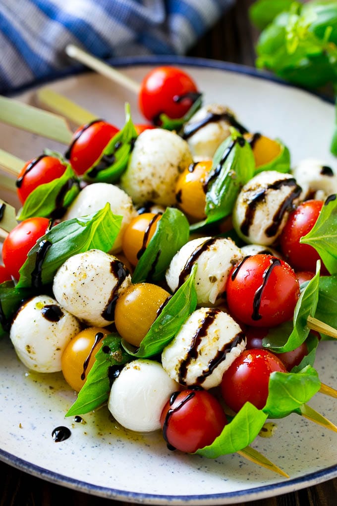 Caprese Skewers | Caprese Kabobs | Caprese Appetizer #tomato #mozzarella #basil #caprese #appetizer #jonep Caprese skewers with mozzarella, cherry tomatoes and basil with balsamic glaze.