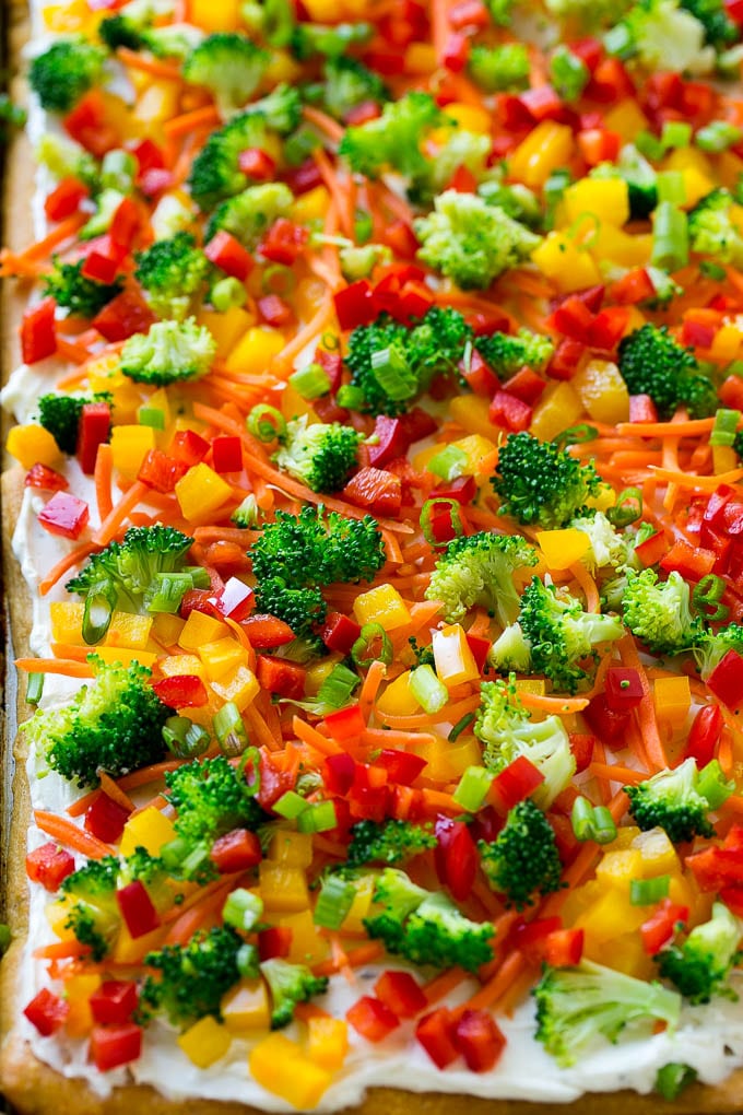 Veggie Pizza Recipe | Crescent Veggie Pizza | Vegetable Pizza Recipe | Holiday Appetizer | Homemade Veggie Pizza #pizza #veggies #vegetarian #appetizer #jonep Veggie pizza on a crescent roll crust with colorful fresh vegetables.