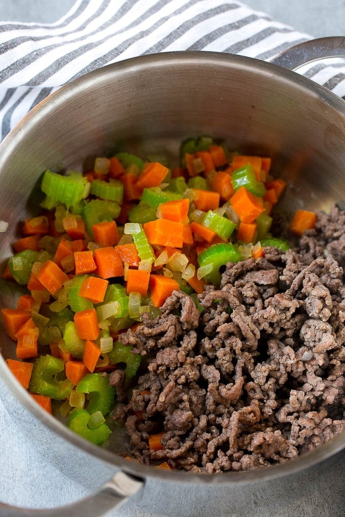 Hamburger Soup Recipe | Hamburger Stew | Ground Beef Soup #hamburger #soup #groundbeef #stew #dinner #jonep Ground beef is added to the vegetables in a pot.